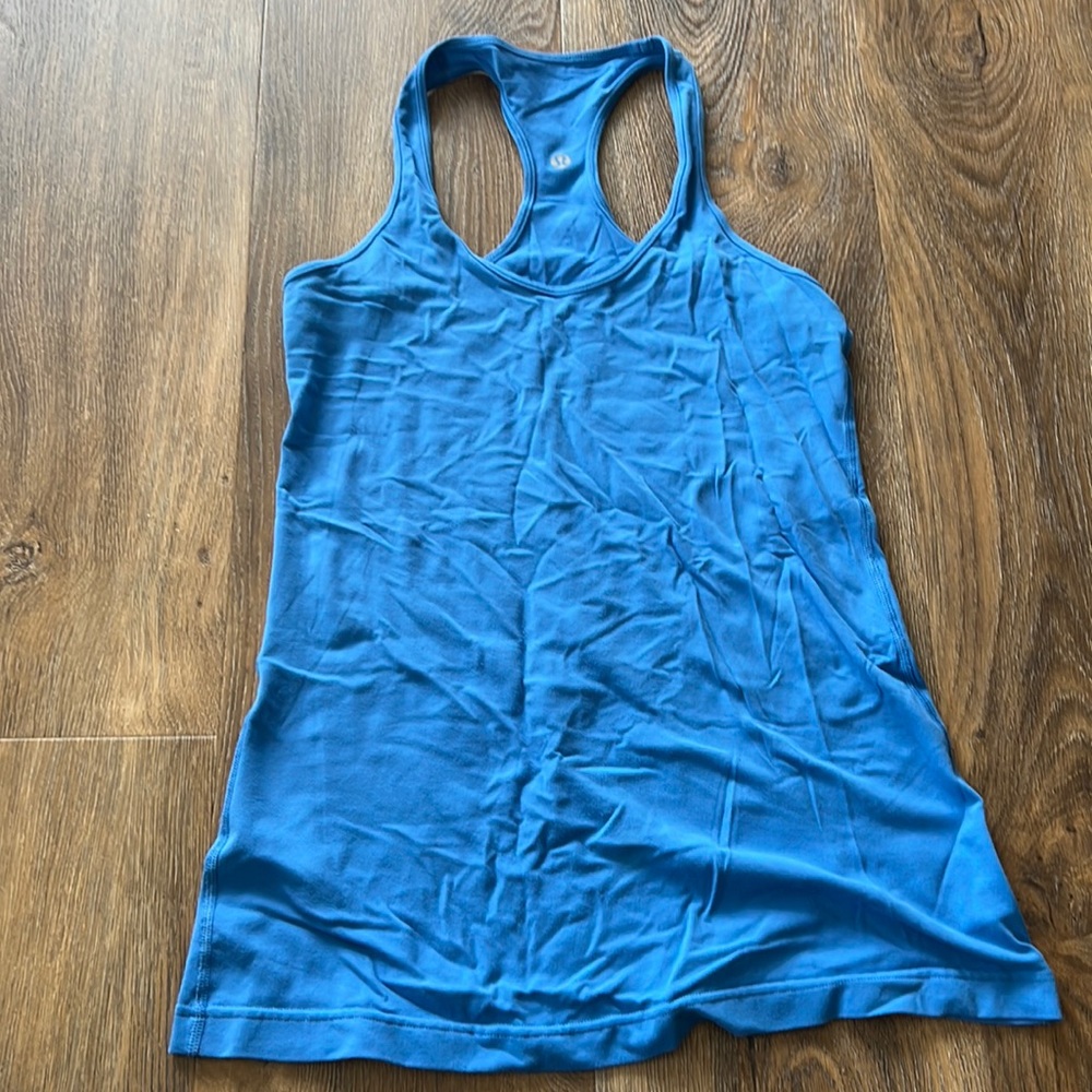 Size 8 blue racer back. Fitted Nulu material. Hip length